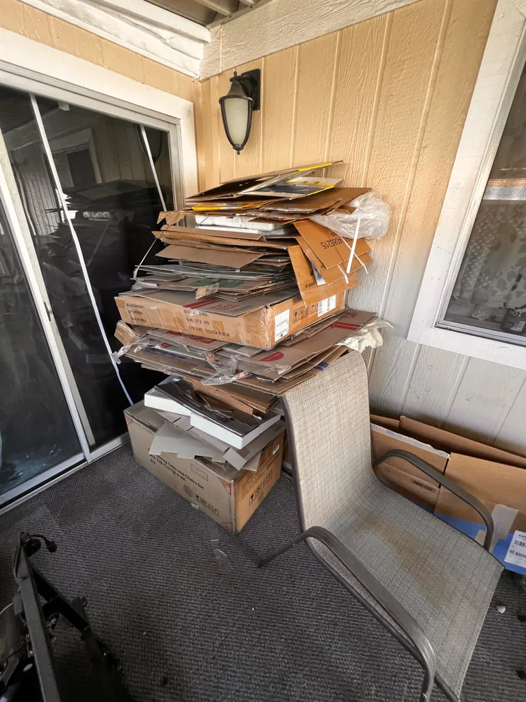 Construction lumber and doors stacked for debris removal in Orange County, CA