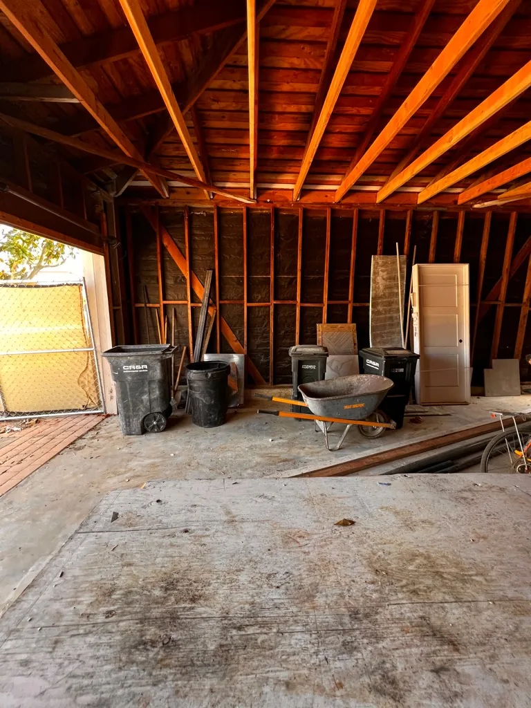 Remodel debris including a water heater and lumber removed in Orange County, CA