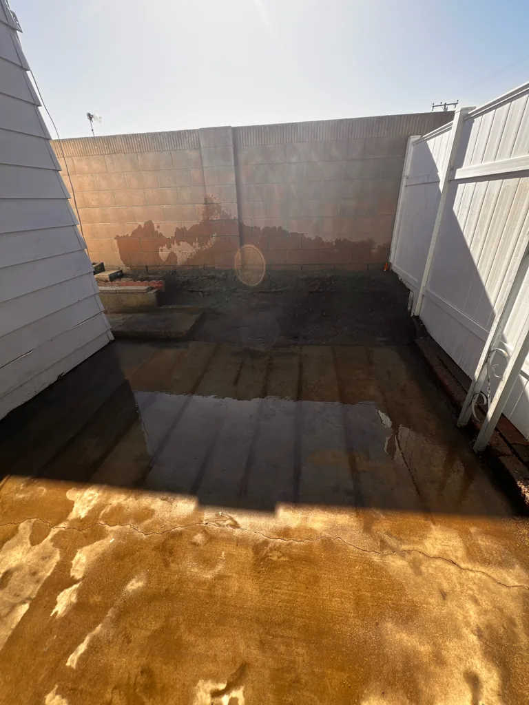 Cleared yard after deck demolition and haul-away in Orange County, CA