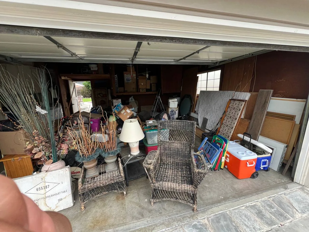 Garage packed with left-behind furniture cleared for a foreclosure property in Orange County, CA