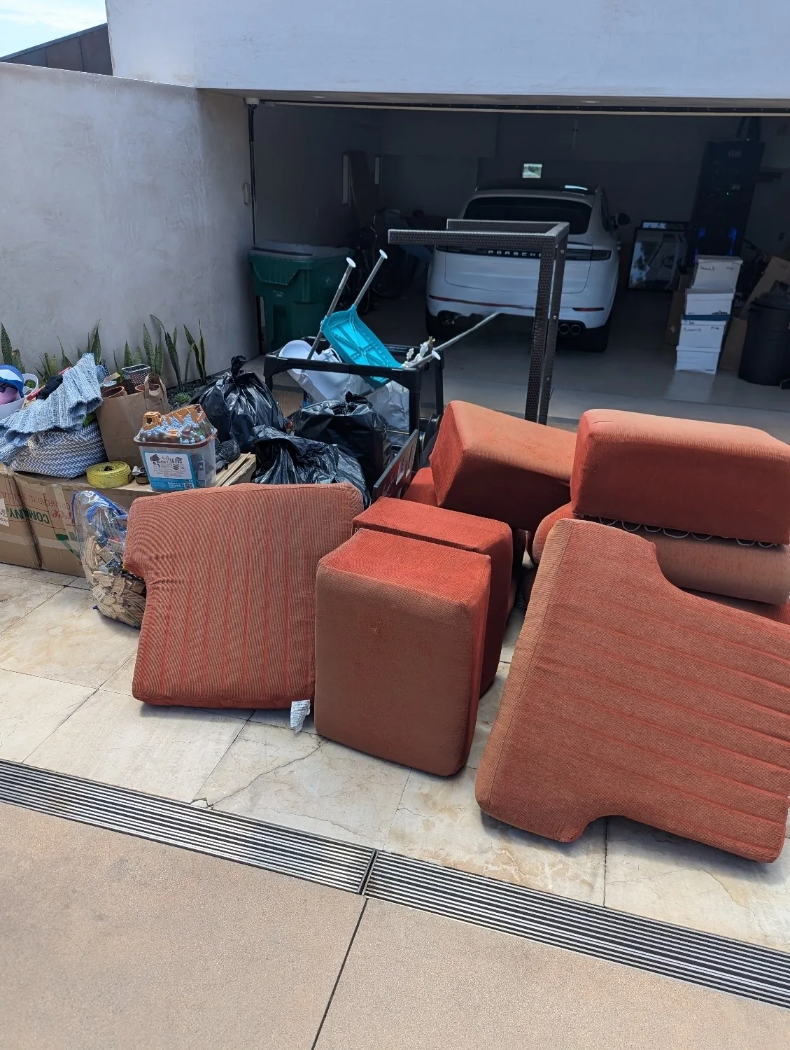 Sectional couch removed from an Orange County garage by EA Junk Removal
