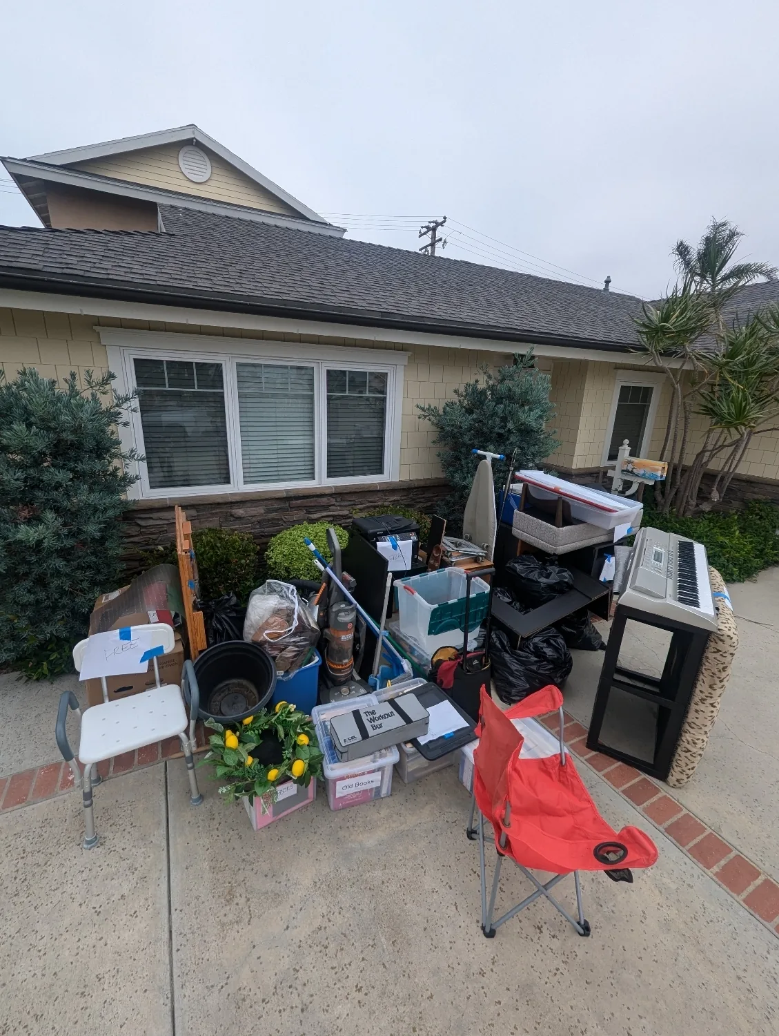 Curbside pile of household junk removed during a residential cleanout in Orange County, CA