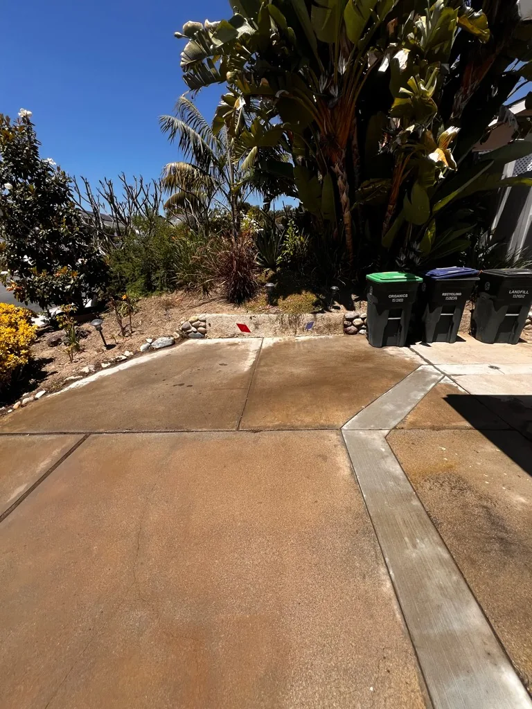 Cleared driveway and side yard after a debris haul-away in Orange County, CA